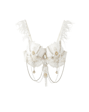 Haló - White - Top: A white bra adorned with lace, hand-sewn pearls, gemstones, feather-accented straps, and hanging chains, displayed on a plain white background.