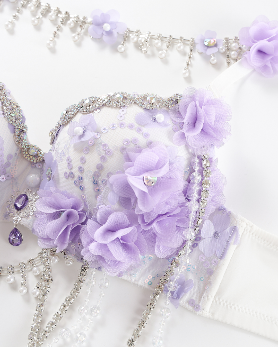 Lavendelle - Purple - Top: A lavender bra adorned with fabric flowers, beads, sequins, and rhinestones, paired with a matching beaded floral accessory displayed above it on a white background.