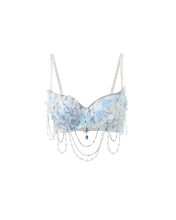 The Icemuse - Blue - Top features a blue and white floral design with white straps, ruffle trim, and pearl-like bead chains draped across the front.
