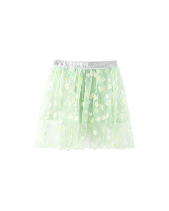 The Soleá - White/Green skirt features a light green mesh design with white daisy patterns and a silver elastic waistband, shown on a plain white background.