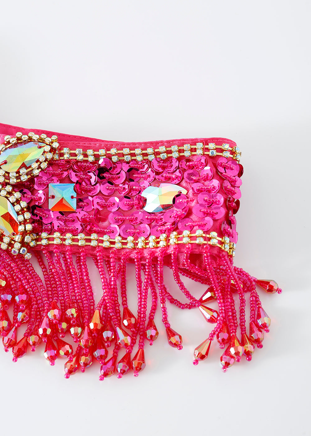 A close-up of the Vixen - Rosé - Bottom showcases decorative pink fabric with sequins, beads, and dangling fringe embellishments, ideal for vibrant festival wear or a dazzling rave outfit against a white background.