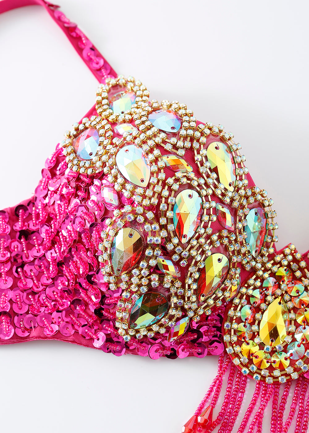 Close-up of the Vixen - Rosé - Bottom, featuring pink fabric embellished with large iridescent gemstones and gold rhinestones—an eye-catching choice for festival wear or as a standout rave outfit piece.