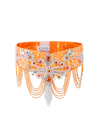 The Lustre - Coral - Bottom features intricate beadwork, rhinestones, and beaded chains over shiny orange fabric—ideal for pairing with a rhinestone bra top for standout handcrafted festival or rave wear.