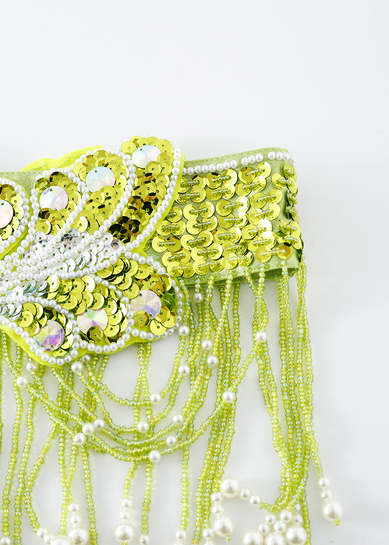 Close-up of the "Venya - Lime Green - Bottom," a handcrafted festival piece adorned with yellow sequins, white faux pearls, and beaded fringe—ideal for creating a standout rave festival outfit.