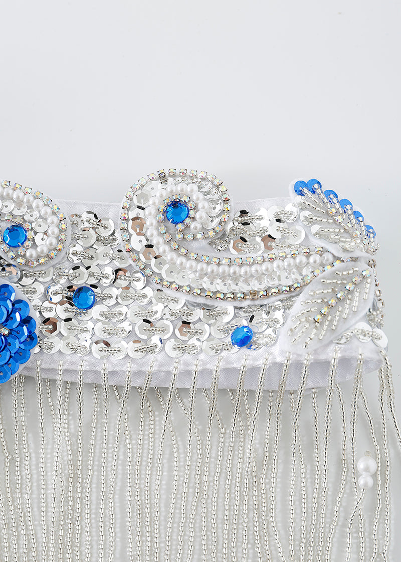 Close-up of decorative white fabric with blue and silver sequins, beads, and hanging silver chains in a swirling pattern—perfect as the Imperya - Silver - Bottom for standout ChillFit Rave or festival wear.