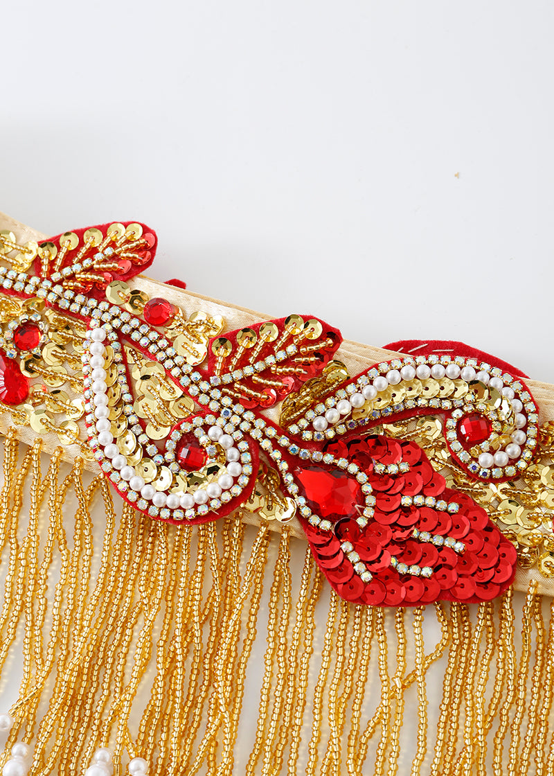 Close-up of Imperya - Gold - Bottom: ornate trim with red, gold, and white beads, sequins, and dangling gold bead fringe—perfect for rave or festival outfits or as a bold detail on your next embellished bra top.