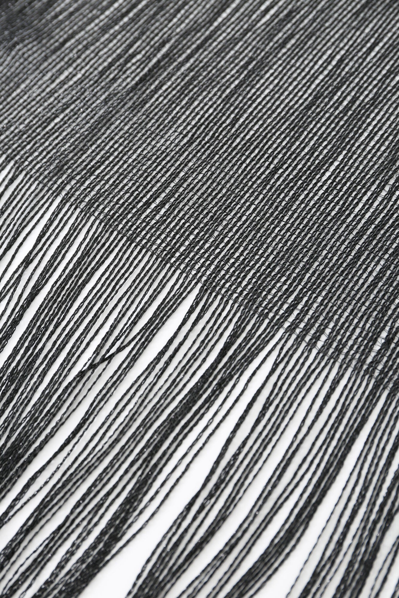 Close-up of the Pashmina - Black Sheer Fringe on a white background.