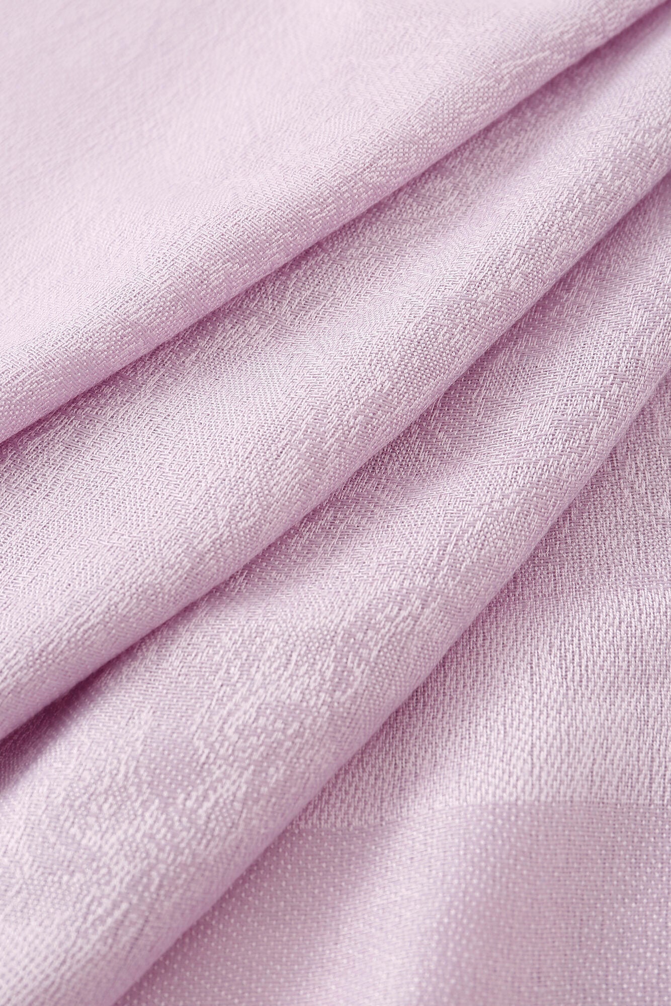 Close-up of the Pashmina - Lavender Solid Fringe, folded to display its fine weave and soft, textured fabric.