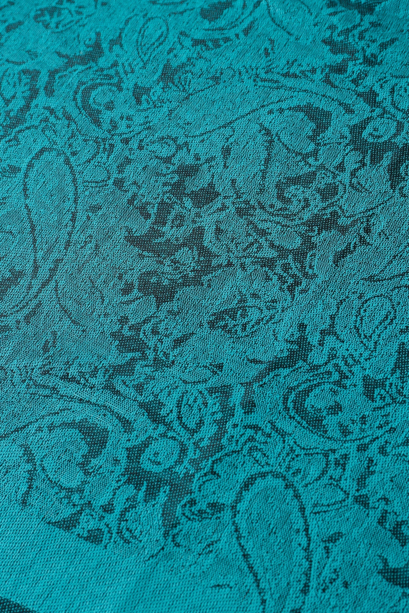 Teal Pashmina scarf featuring a dark blue peacock paisley pattern and fringed edges.