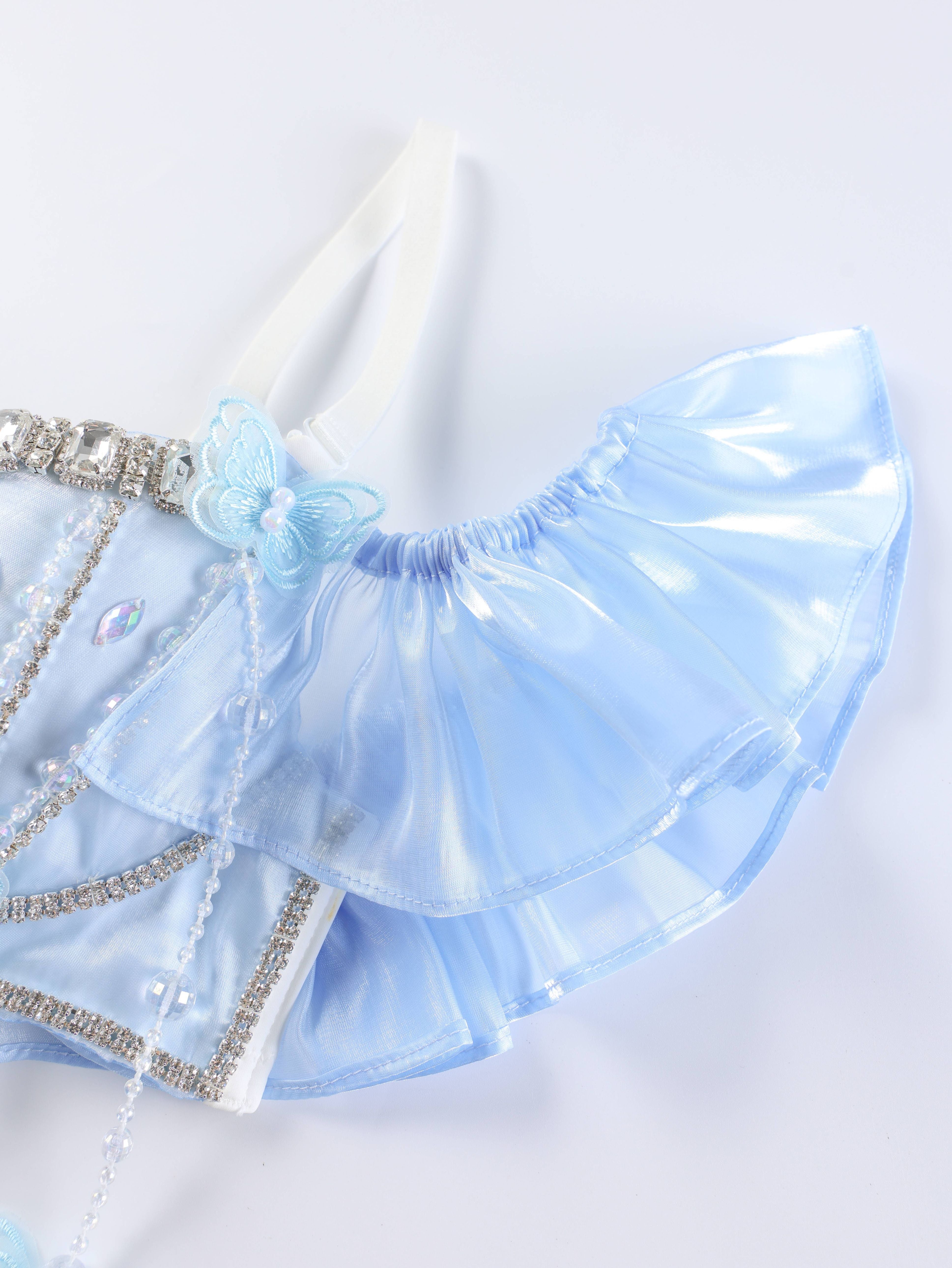 Close-up of the Pearl Wing - Full Set - Blue: light blue, shiny ruffled fabric with rhinestone trim, pearl details, and a decorative butterfly accent—ideal for handcrafted bra tops or unique rave festival wear—on a white background.