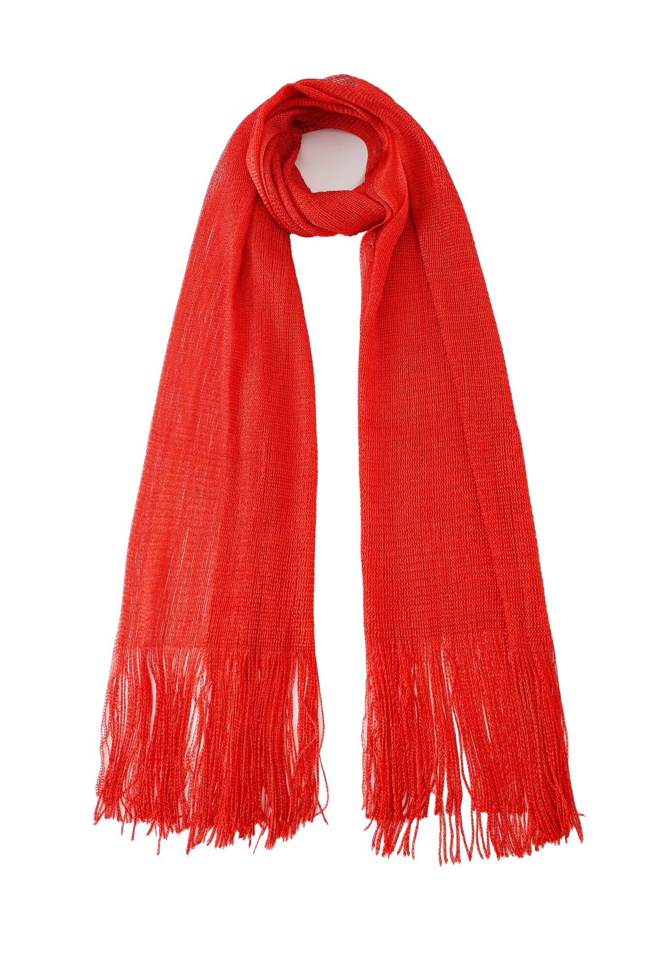 The Pashmina - Scarlet Fringe is a red knit scarf featuring fringe at both ends, displayed flat on a white background.