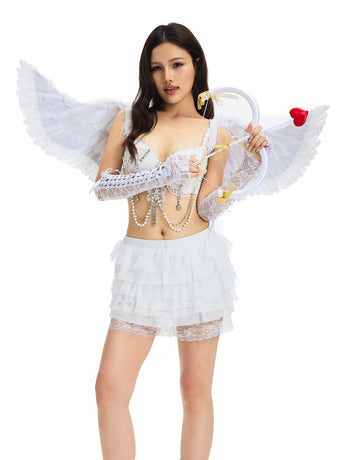 A woman wearing a white lace angel costume with wings and the Petal Lace Mini Shorts - White holds a bow and arrow tipped with a red heart, standing against a white background.