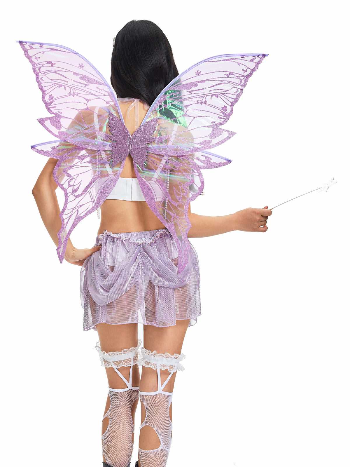 A person in a shiny purple fairy costume with large wings, wearing Butterfly Trap Purple Thigh High stockings and holding a wand, photographed from behind against a white background.