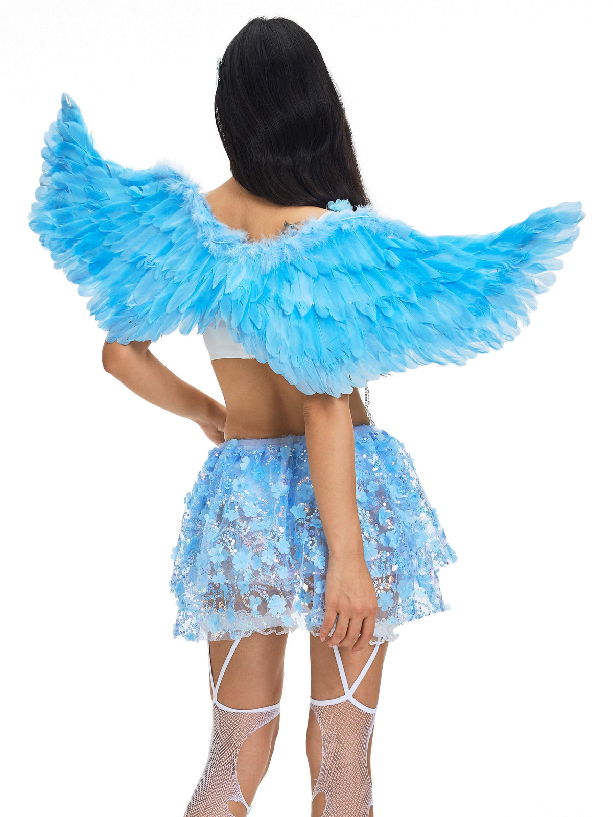 A person models the Angel Wings- Blue, paired with a blue lace skirt, white top, and white fishnet stockings, standing with their back to the camera against a plain white background.