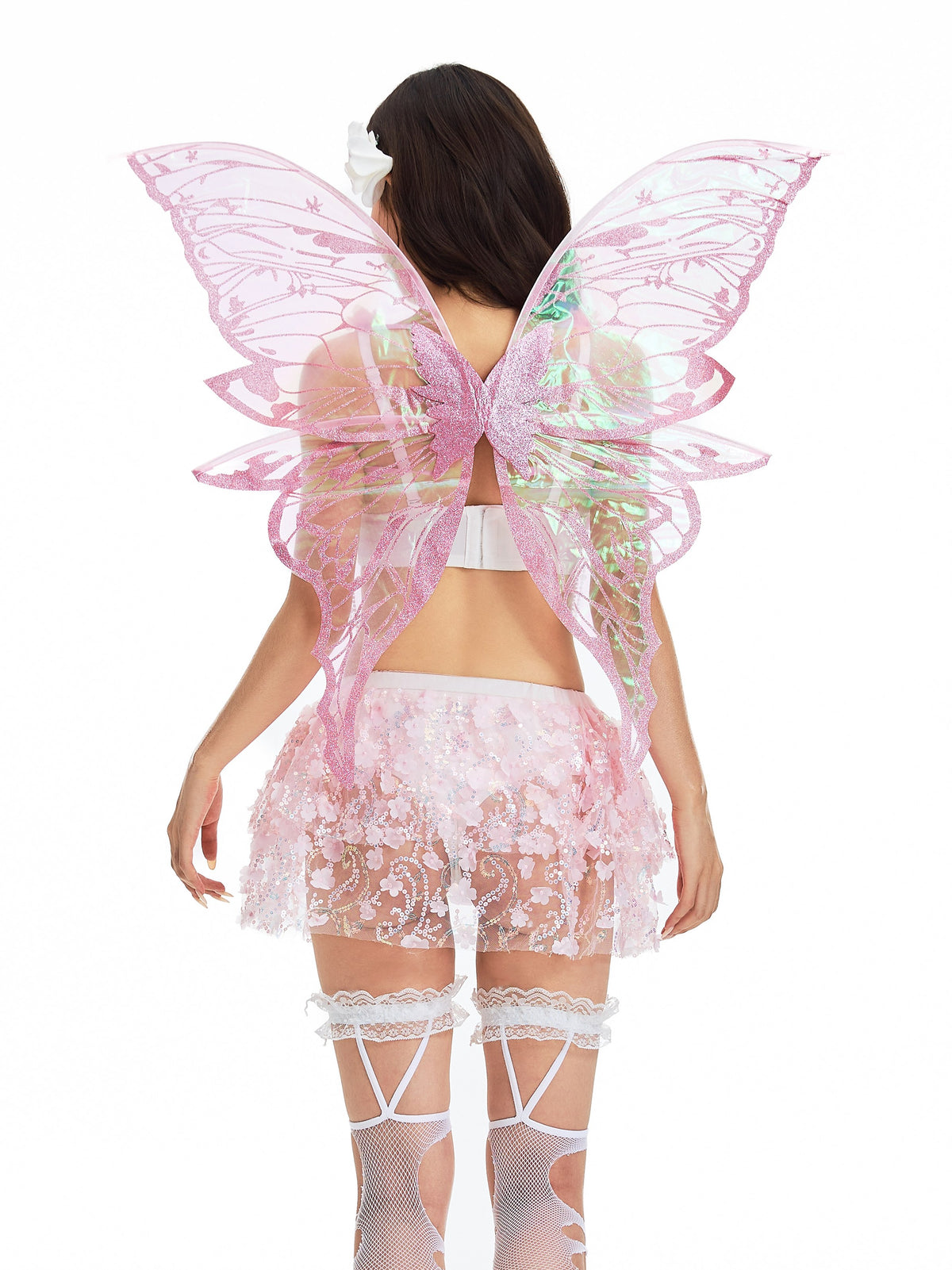 Model wearing pink iridescent fairy wings, a white bra, a sheer pink floral skirt, white garters, and the Butterfly Trap Pink-Thigh Highs, photographed from behind against a white background.