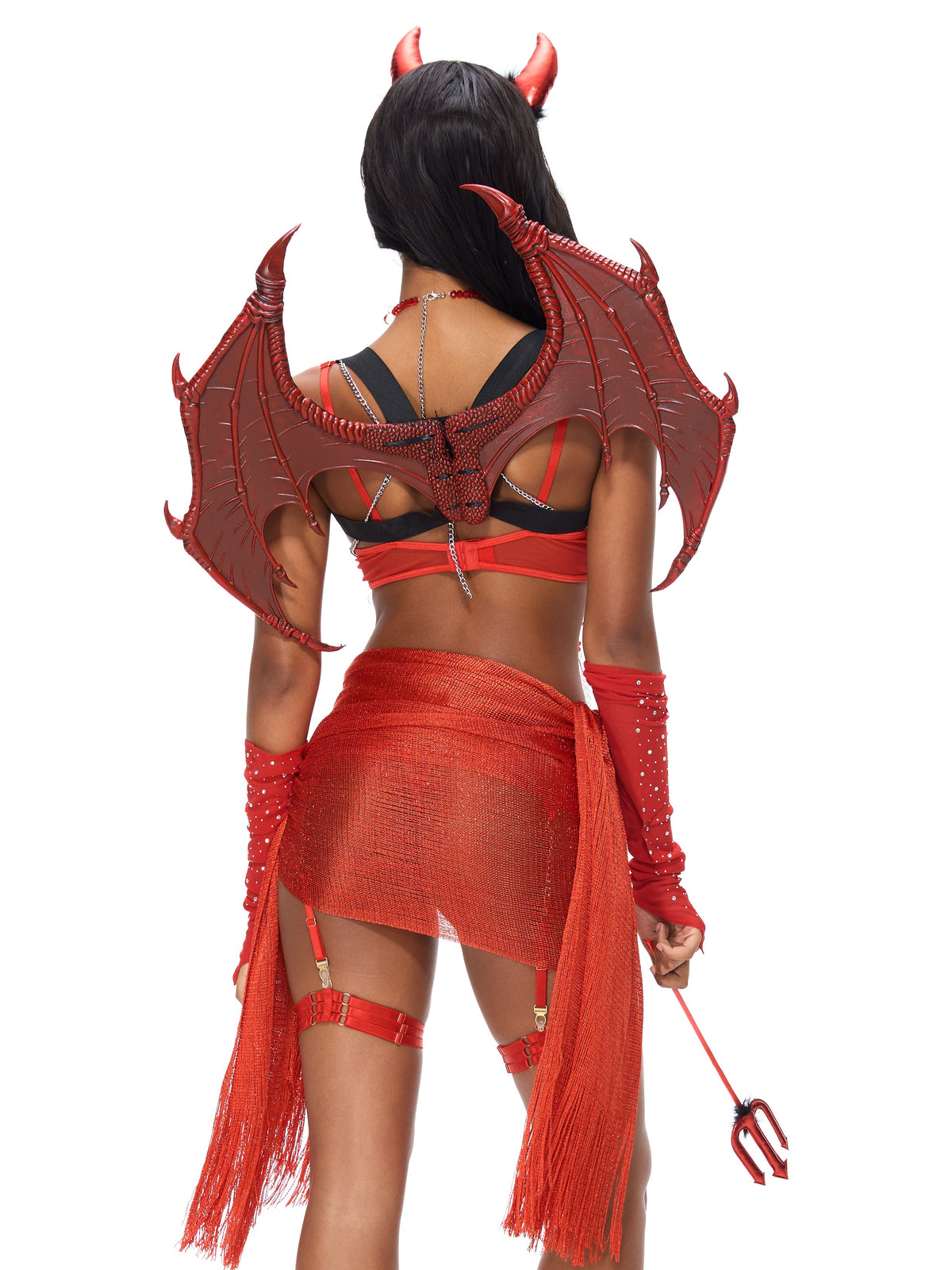 A person photographed from behind against a white background wears the Rosy Leather Wings-Red—dramatic, devil-inspired festival wings that add a striking flair to their red devil costume, complete with horns, a red skirt, arm sleeves, and a trident.