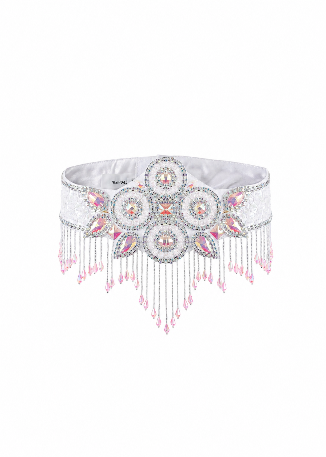 The Vixen-White-Bottom is a beaded white belt adorned with intricate circular patterns of pink and silver beads, finished with dangling beaded fringe along the bottom edge—an eye-catching accessory ideal for festivals or pairing with a crystal bra top to complete your rave look.