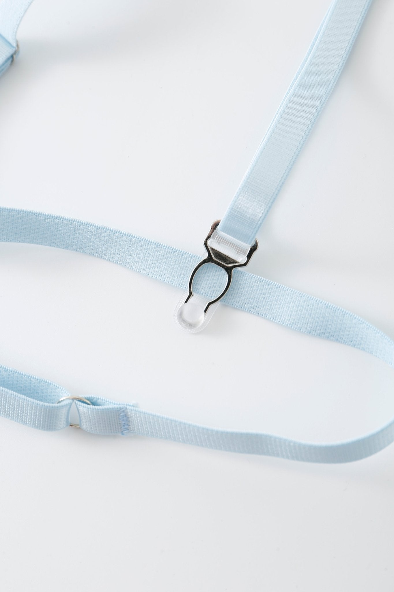 A close-up of the Azura w Mini Skirt- Full Set’s light blue adjustable straps with a metal clasp, featuring subtle rhinestone detailing, displayed on a white background.