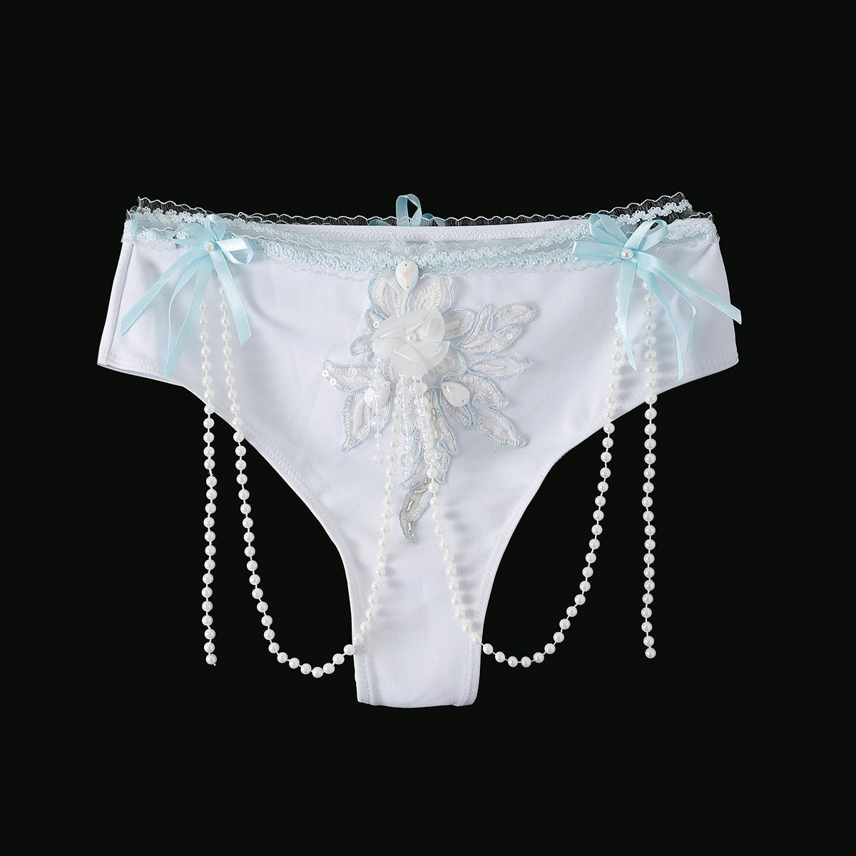 Eira - Full Set - Blue: White lace panties with blue bows, a central floral applique, and pearl bead strands on each side—ideal handcrafted rave festival wear, shown on a black background.