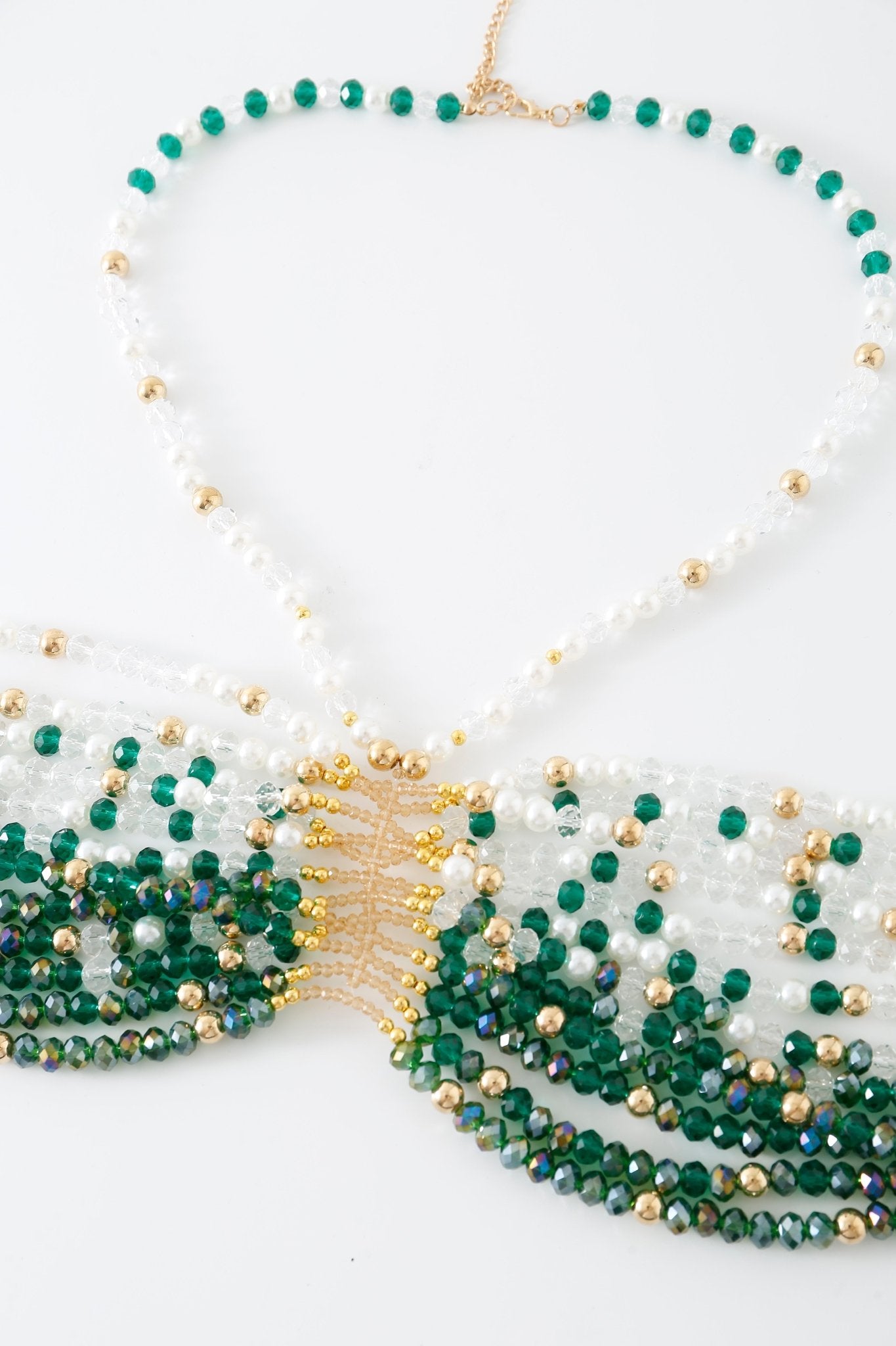 Beaded necklace with green, white, and gold beads, a gold chain, and a central gold accent on a white background—perfect for pairing with the Eve w Mini Skirt- Full Set or adding subtle sparkle when layered over Eve lingerie.