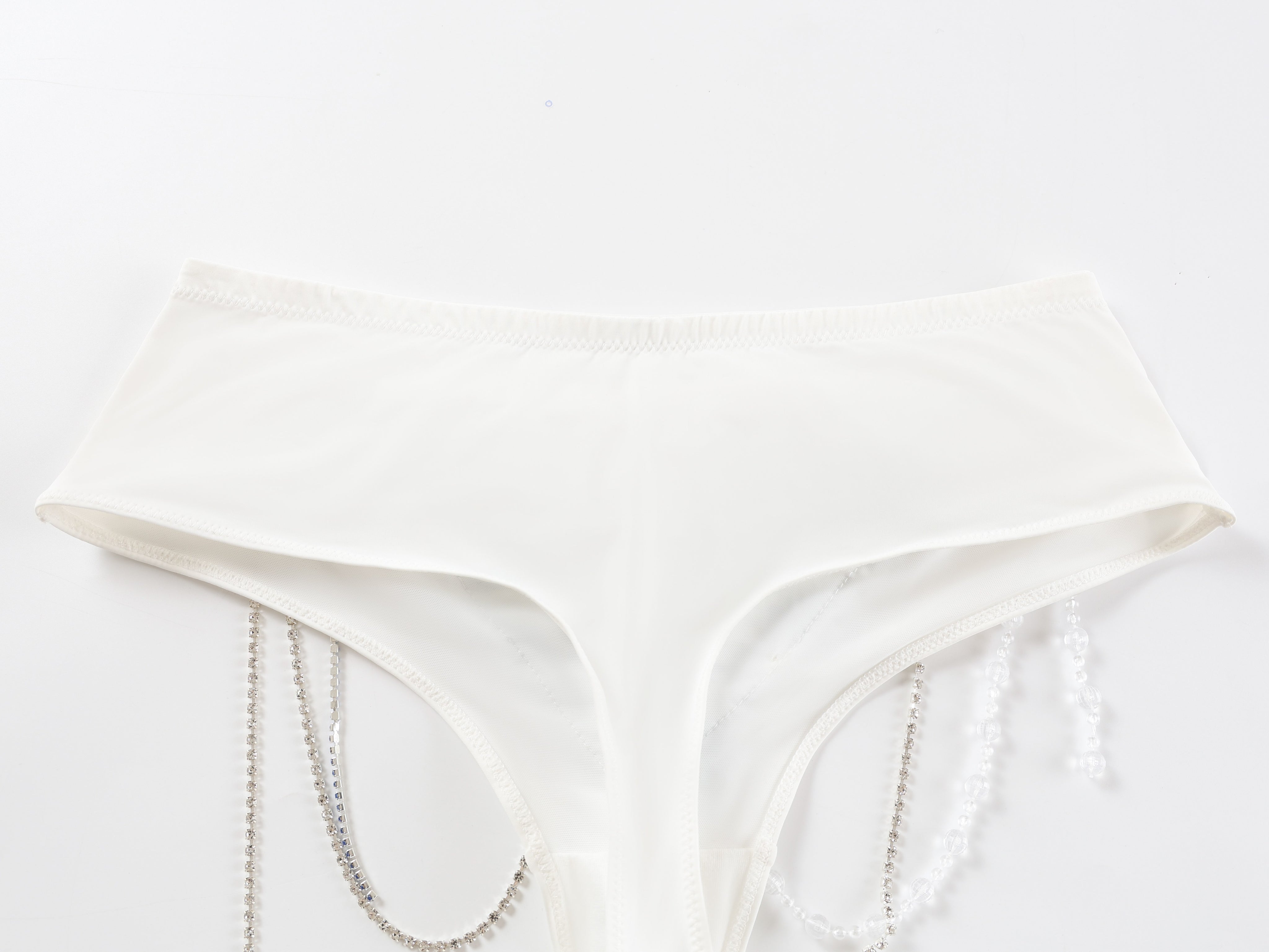 The Icemuse - Blue - Bottom features high-cut sides with hanging pearl and chain embellishments, ideal as handmade rave attire or standout festival wear, shown against a plain white background.