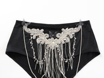 Nocterra - Black - Bottom: High-waisted black underwear for raves, handcrafted with rhinestones, silver fringe, and black butterfly accents on a white background.