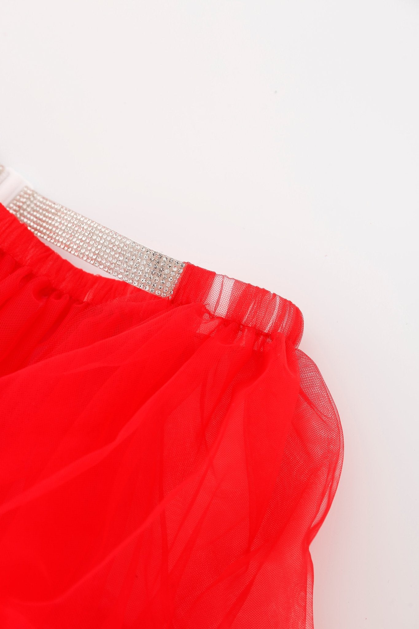 Close-up of the Poppy w Mini Skirt - Full Set, featuring a red mesh mini skirt with a silver rhinestone-studded waistband and subtle rhinestone accents, set against a white background.