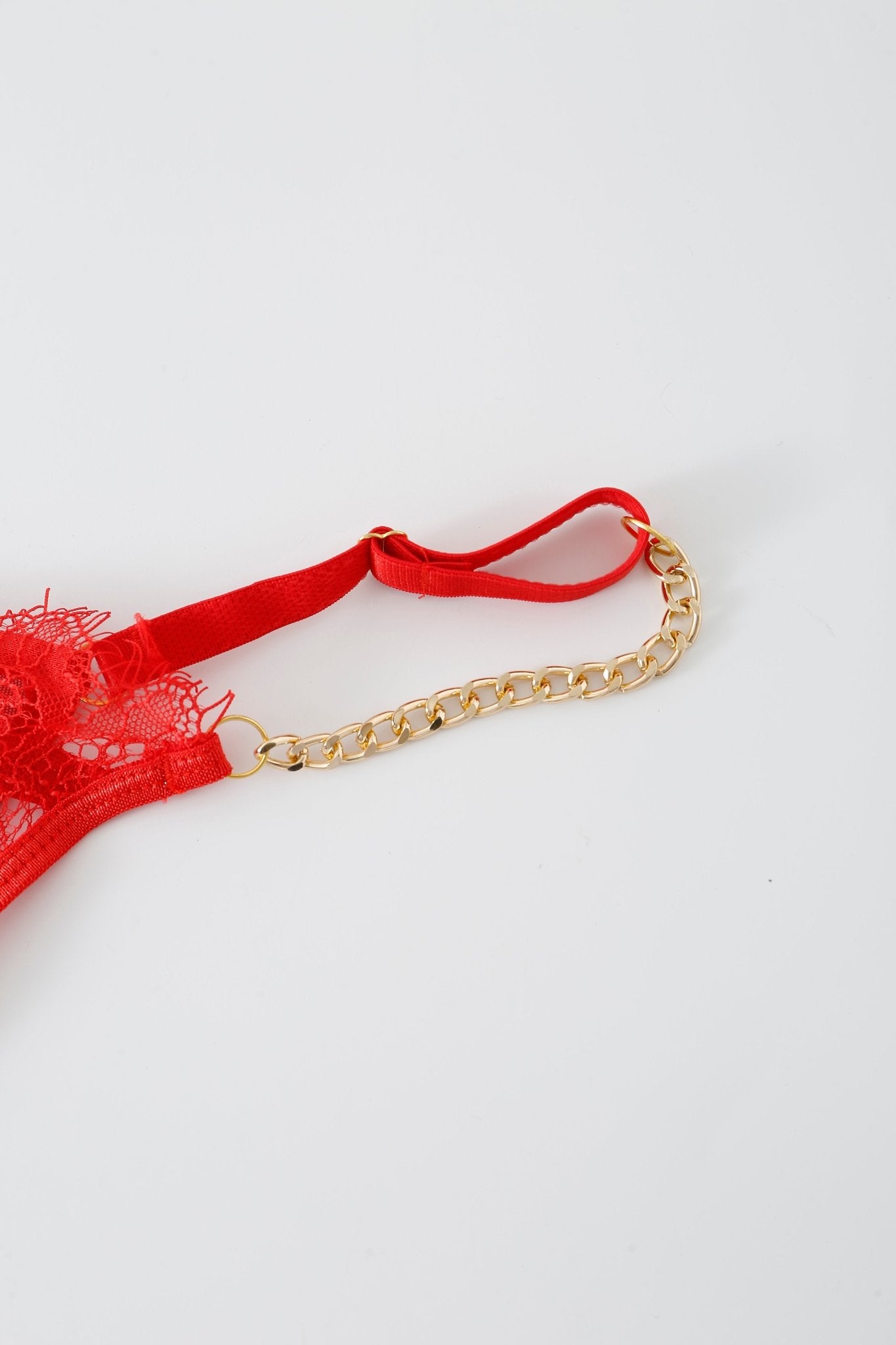 Close-up of the Poppy w Mini Skirt- Full Set featuring a red lace strap with rhinestone detailing attached to a gold chain with a hook, photographed on a plain white background.