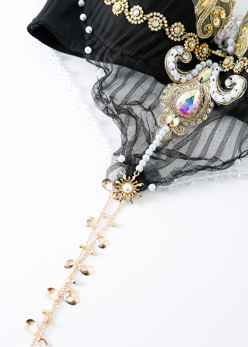 The REVERIE - Full Set - Black features an ornate bra with gold, pearls, beadwork, sequins, a teardrop gem, and chain details—handcrafted rave wear ideal for any festival costume.